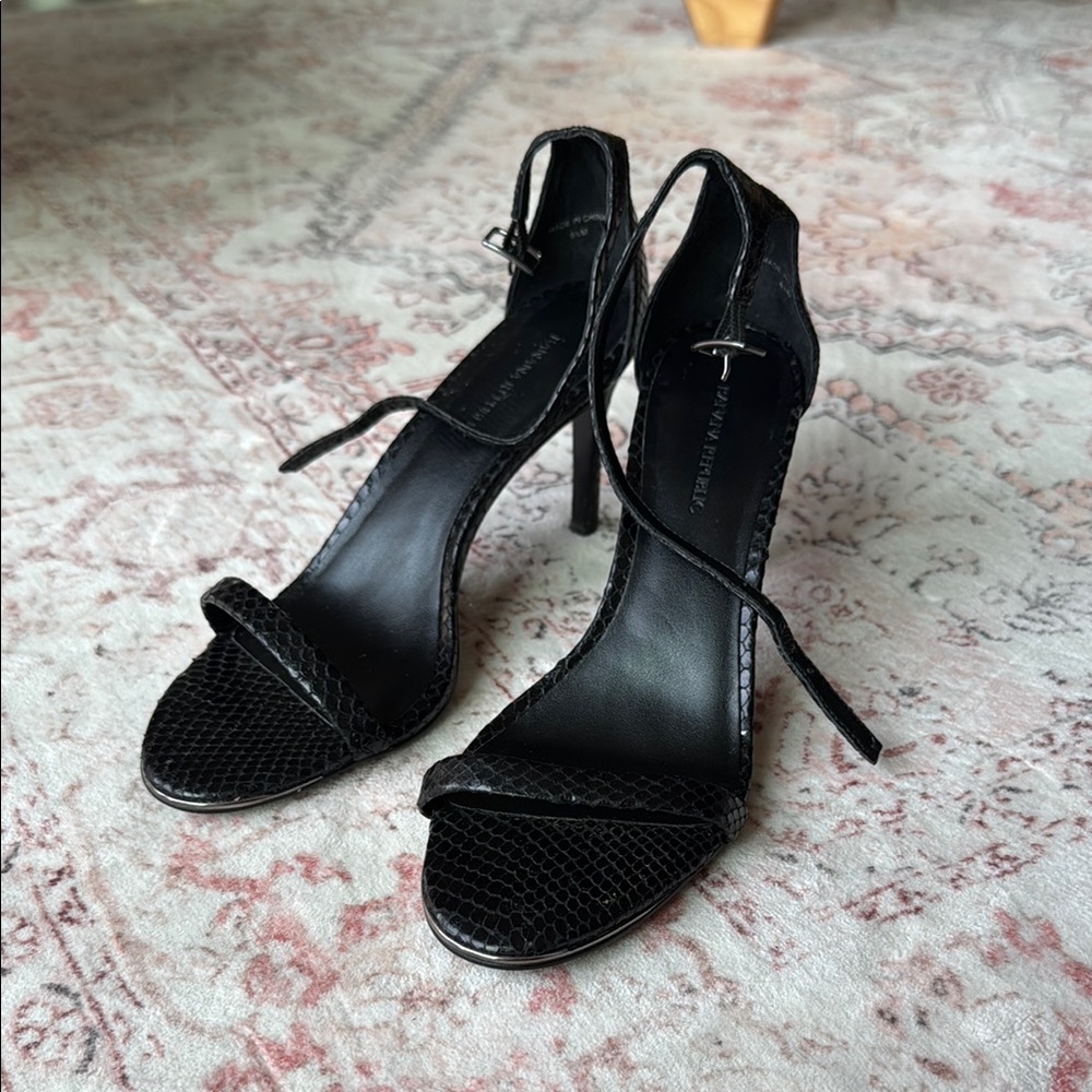 Black snakeskin heels